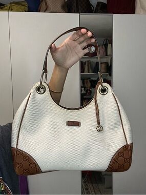 Gucci cream canvas and brown leather hobo shoulder bag.